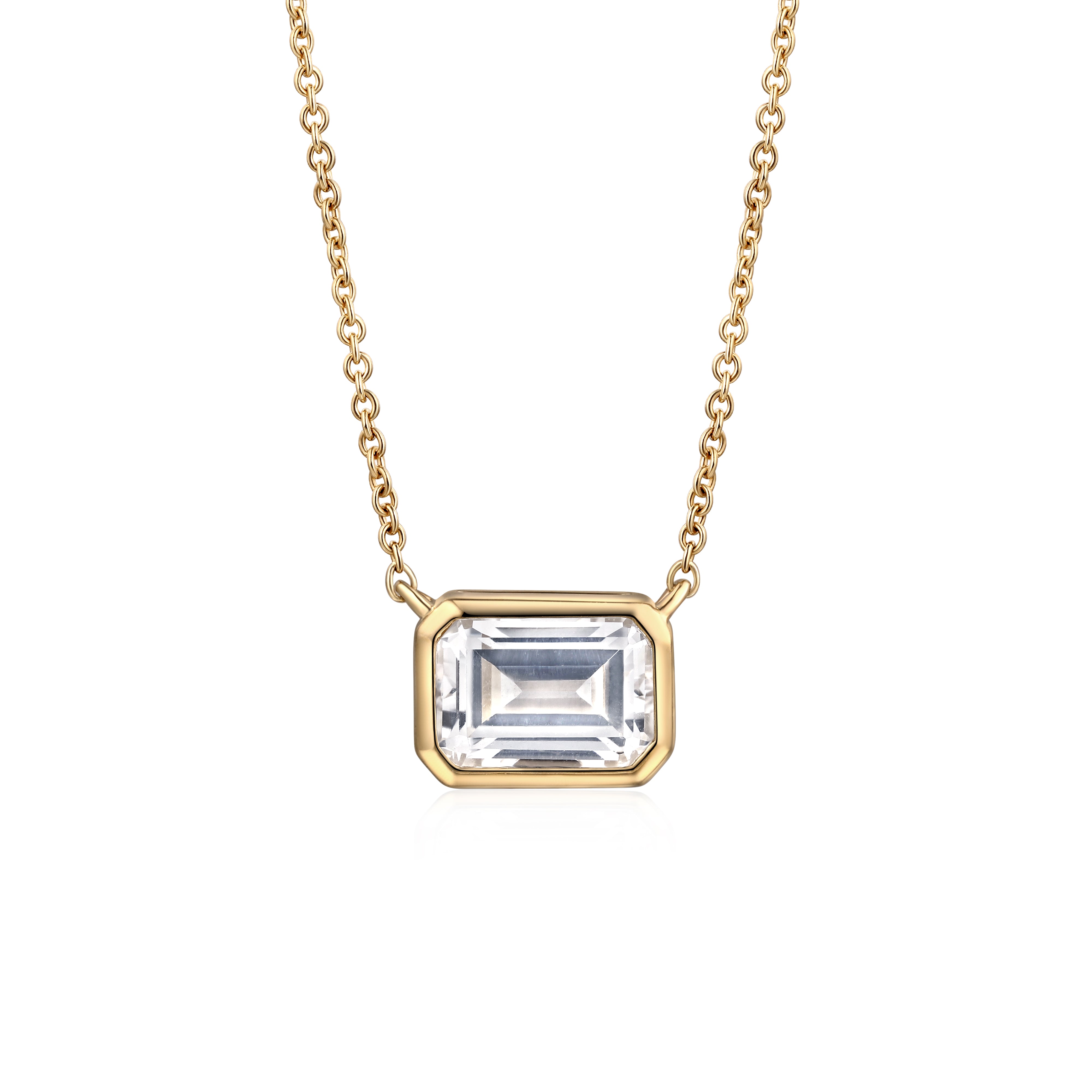 gold bezel necklace with white sapphire in 10 karat yellow gold