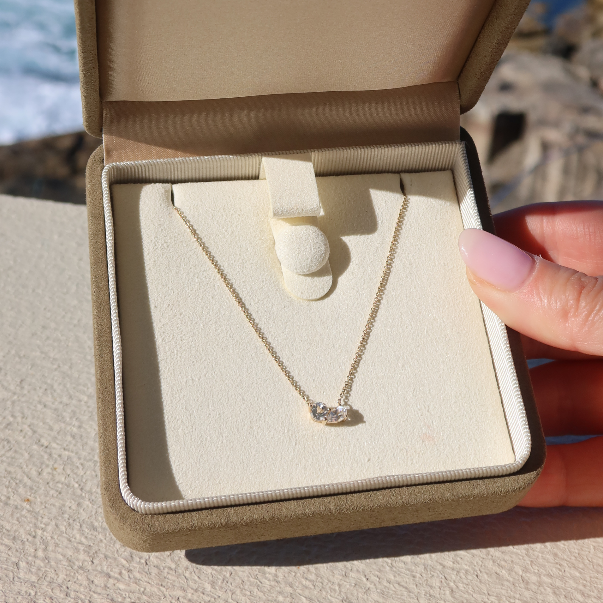 Toi et Moi gold necklace with white sapphire stones in 10 karat yellow gold
